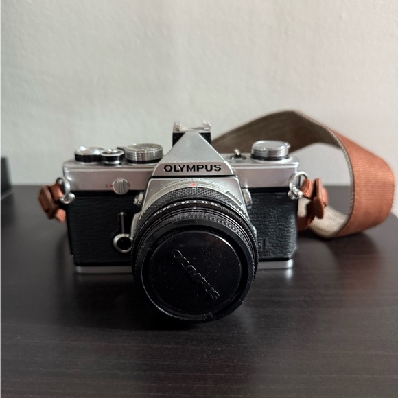 Olympus OM-1 Vintage Black and Silver Camera with Brown Strap - Picture 1 of 3